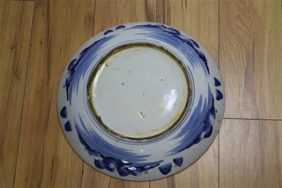 A Japanese Arita blue and white charger and a Chinese pottery figure charger diameter 40cm